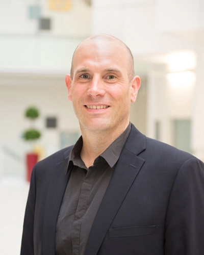 Dr. Chris Carlsten headshot